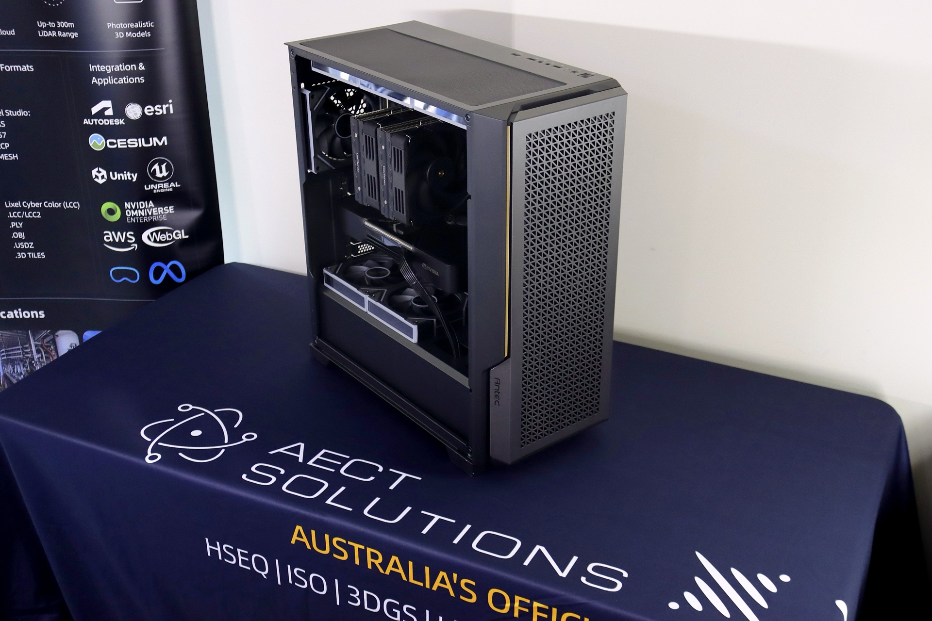 AECT AI workstation open-case build with dual-GPU headroom, on display at the AECT XGRIDS booth