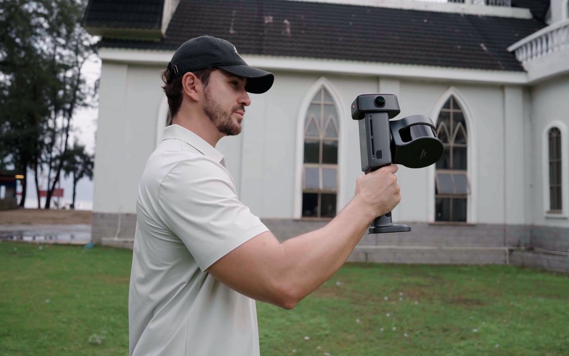 XGRIDS Lixel L3 handheld scanner in use with the optional support rig