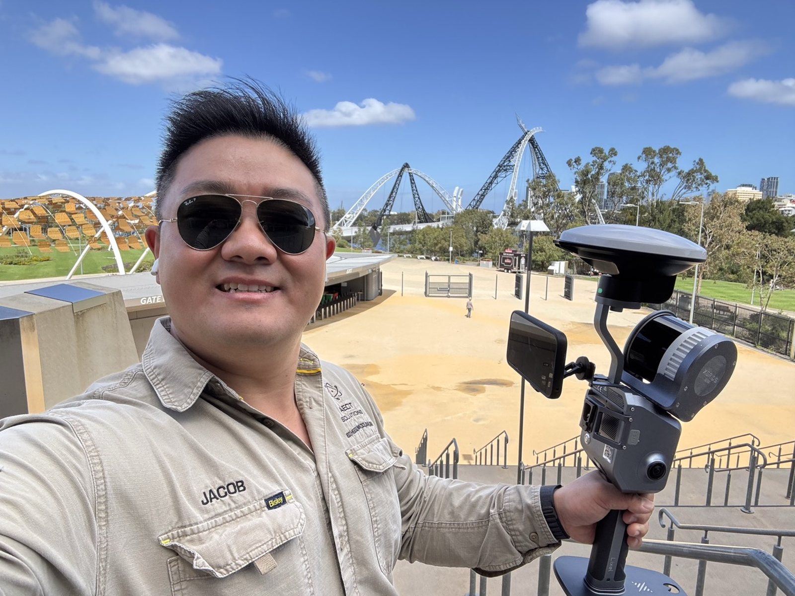 Jacob Lee scanning at Optus Stadium, Perth, with an XGRIDS handheld scanner