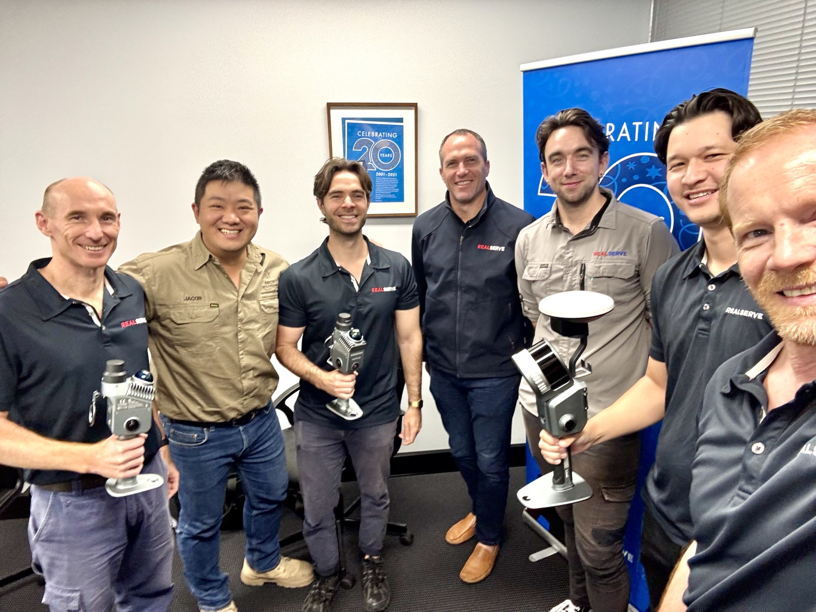 Survey team with new XGRIDS scanner and GNSS equipment