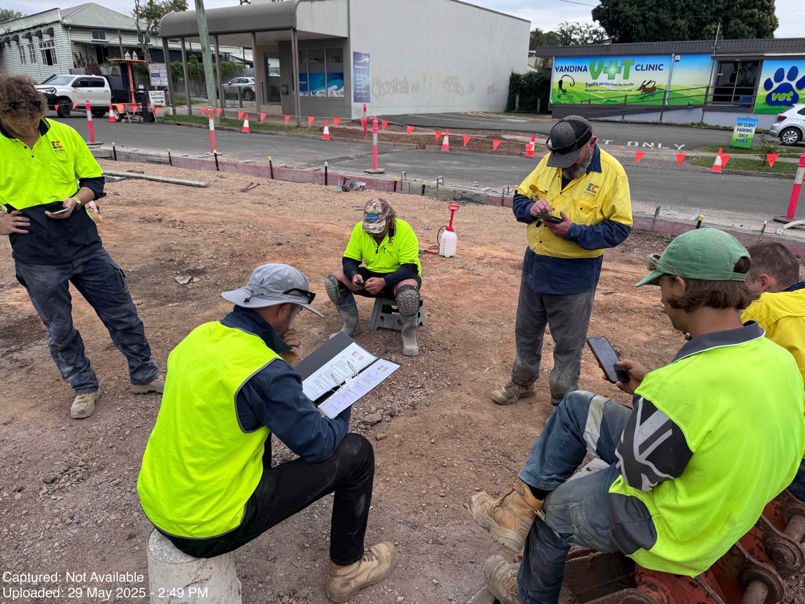 Pre-start briefing with paperwork on a subgrade site