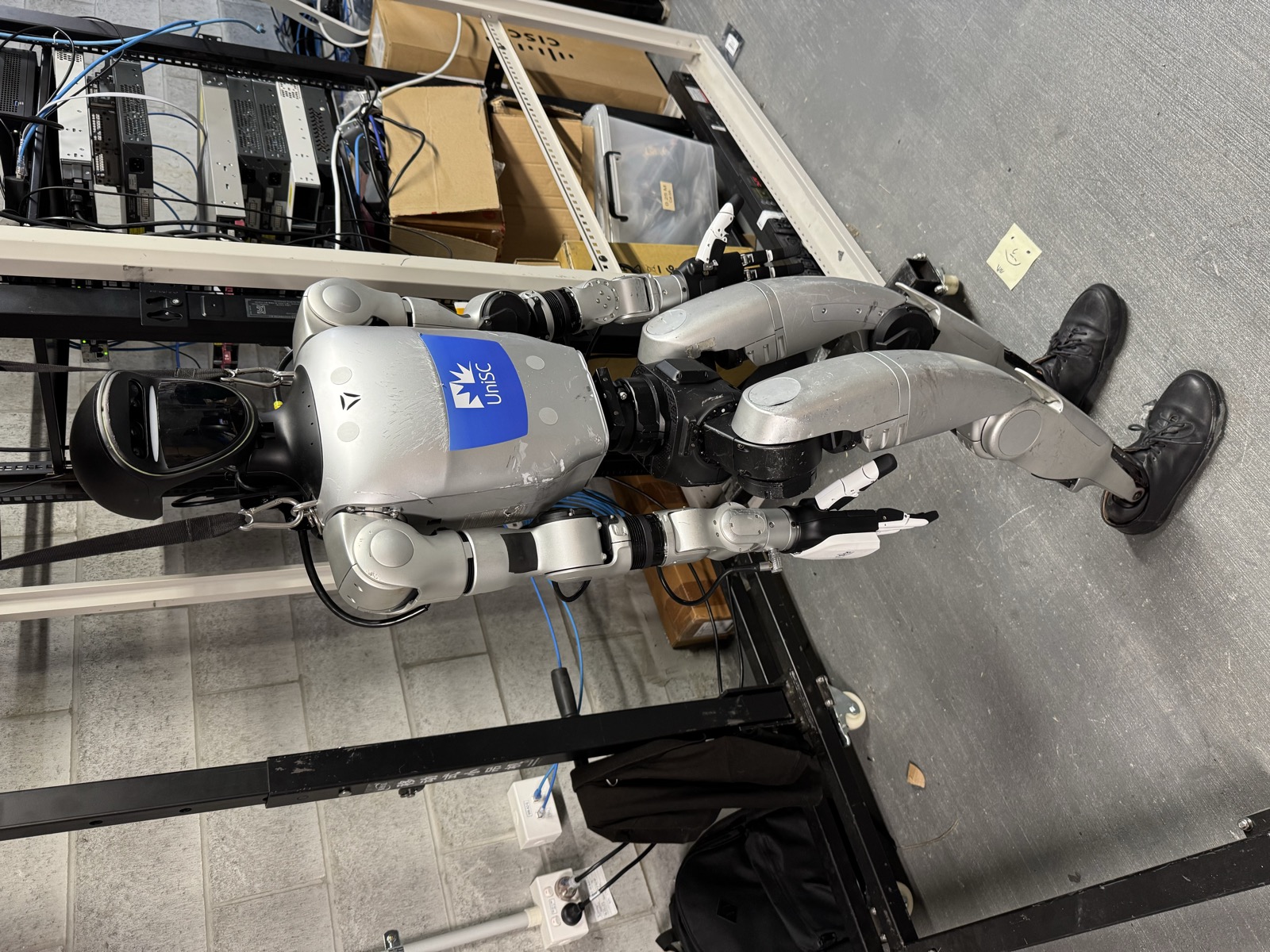 Humanoid robots on a training rack